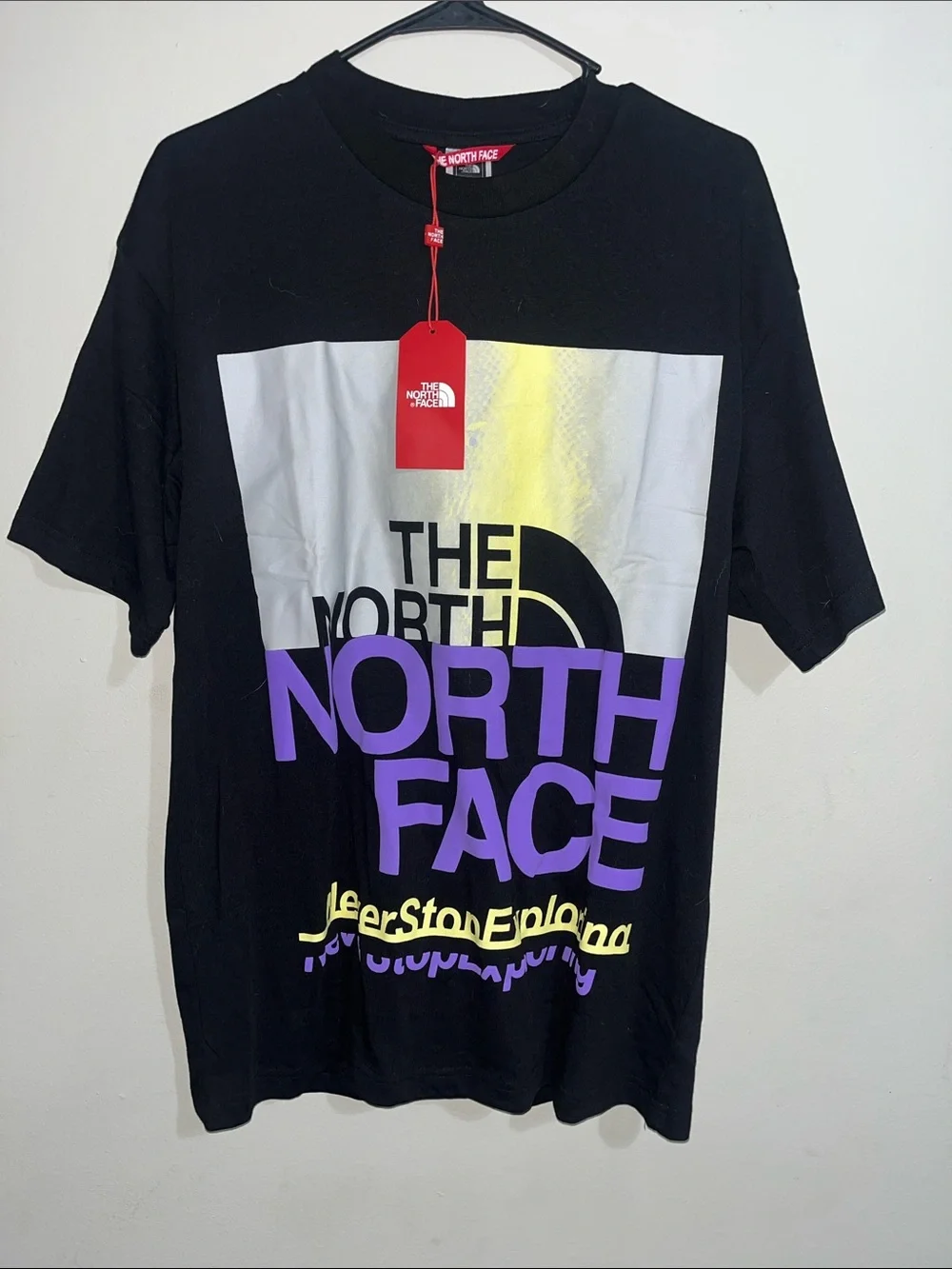 The North Face Black Tee with Purple & Yellow Logo